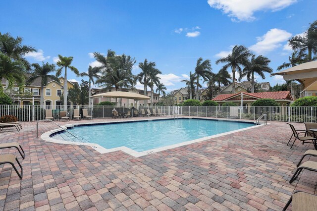 111 Tullamore Ave, Jupiter, FL 33458 - community pool with a patio and a residential view
