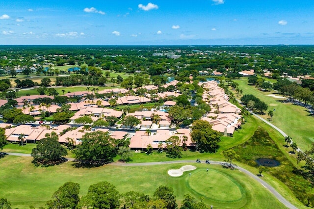 aerial overview of property's location featuring nearby suburban area and a golf course