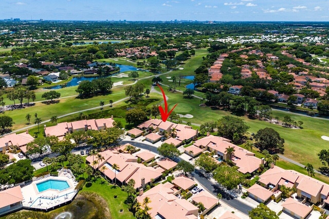 aerial view of residential area with a golf club and a nearby body of water