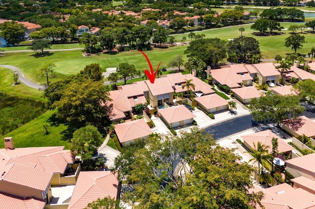 aerial view of residential area with a local golf course