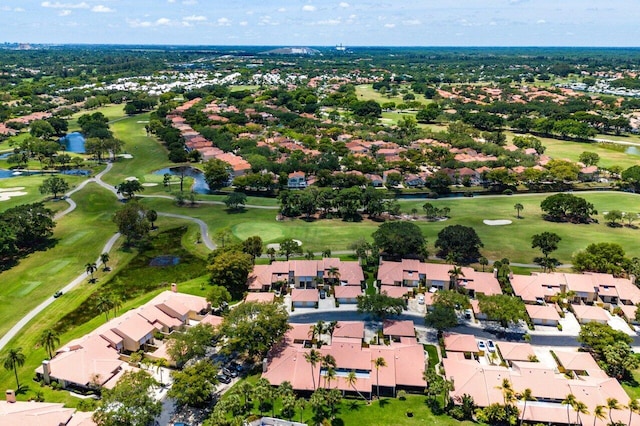 aerial view of residential area with a nearby body of water and a golf club