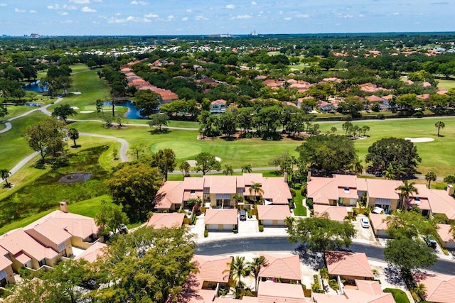aerial perspective of suburban area with a large body of water and a golf club