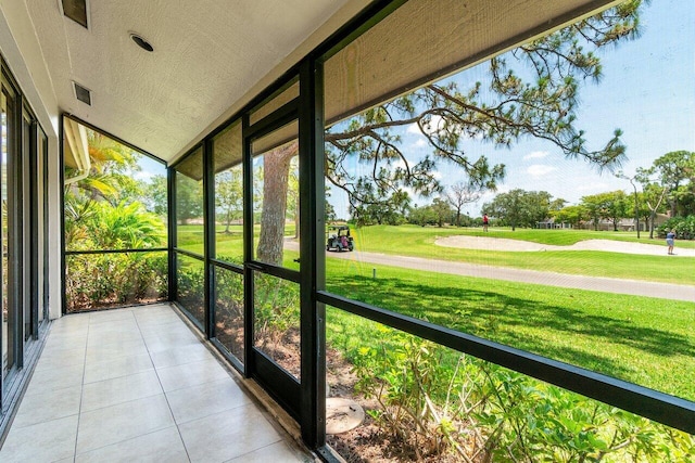 unfurnished sunroom featuring golf course view