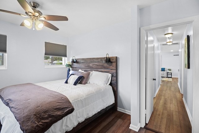 764 Westwind Dr, North Palm Beach, FL 33408 - bedroom featuring hardwood / wood-style flooring, baseboards, and ceiling fan