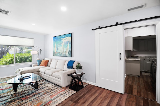 764 Westwind Dr, North Palm Beach, FL 33408 - living area with dark wood-style floors, a barn door, baseboards, and recessed lighting