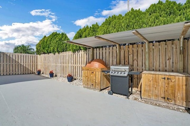 764 Westwind Dr, North Palm Beach, FL 33408 - view of patio / terrace featuring fence and a grill