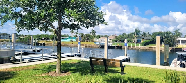 764 Westwind Dr, North Palm Beach, FL 33408 - dock featuring a water view and a lawn