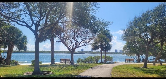 764 Westwind Dr, North Palm Beach, FL 33408 - view of community with a yard and a water view