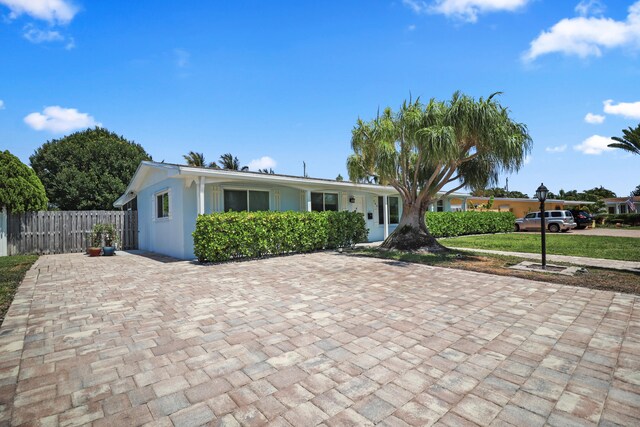 764 Westwind Dr, North Palm Beach, FL 33408 - single story home featuring fence