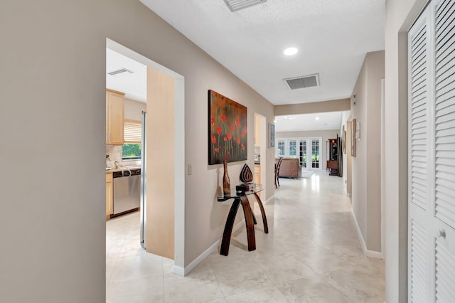 8030 Eastlake Dr Unit 10B, Boca Raton, FL 33433 - hallway featuring light tile patterned floors, baseboards, and recessed lighting