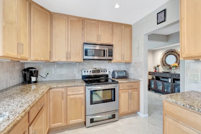 8030 Eastlake Dr Unit 10B, Boca Raton, FL 33433 - kitchen with stainless steel appliances, light brown cabinets, backsplash, and recessed lighting