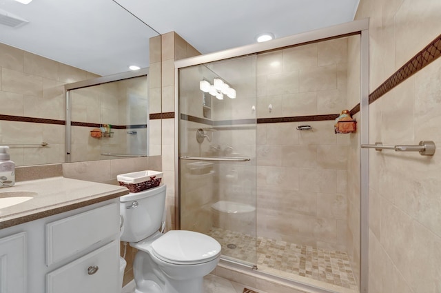 8030 Eastlake Dr Unit 10B, Boca Raton, FL 33433 - bathroom featuring tile walls, a stall shower, vanity, and toilet