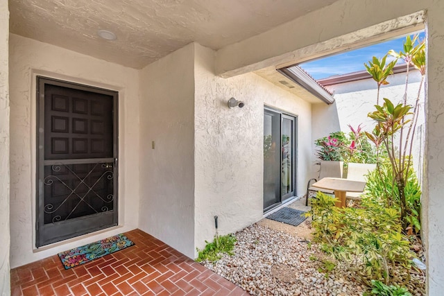 8030 Eastlake Dr Unit 10B, Boca Raton, FL 33433 - view of exterior entry with stucco siding