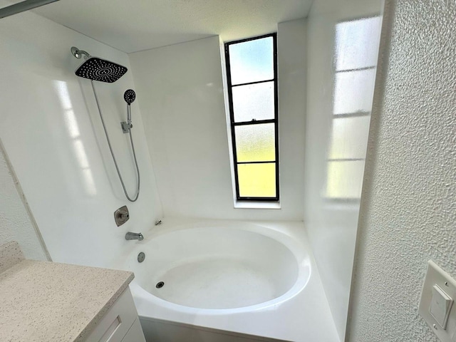 9235 SW 8th St Unit 402, Boca Raton, FL 33428 - full bath featuring plenty of natural light, a textured wall, vanity, and tub / shower combination