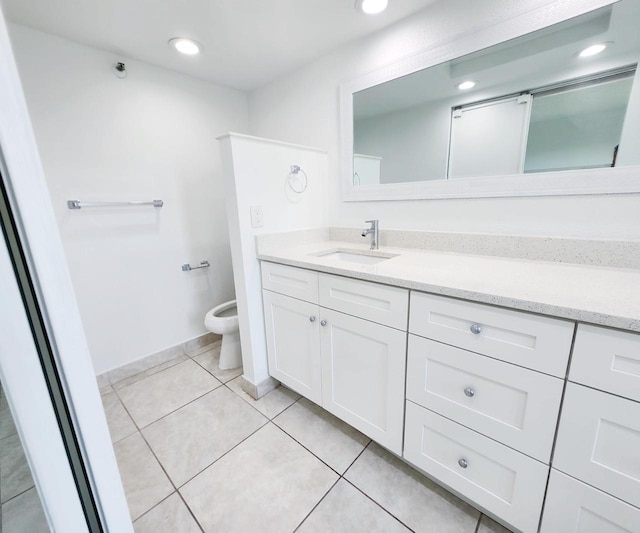 9235 SW 8th St Unit 402, Boca Raton, FL 33428 - bathroom with vanity, toilet, tile patterned flooring, and recessed lighting