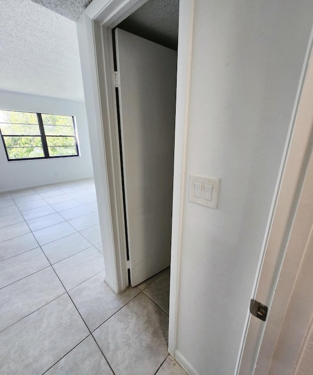 9235 SW 8th St Unit 402, Boca Raton, FL 33428 - hall with a textured ceiling and light tile patterned floors