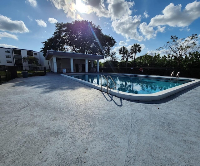 9235 SW 8th St Unit 402, Boca Raton, FL 33428 - community pool featuring a patio area