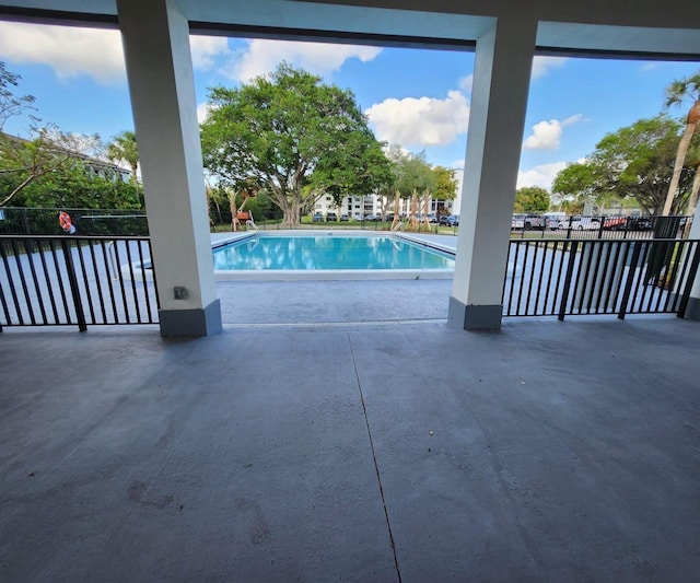 9235 SW 8th St Unit 402, Boca Raton, FL 33428 - community pool featuring a patio area and a water view