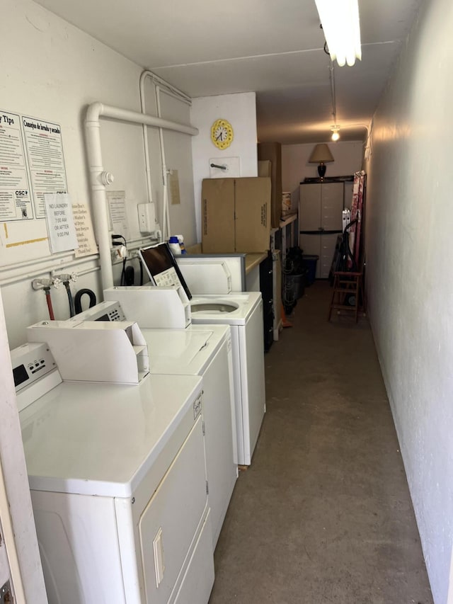 shared laundry area featuring washer and clothes dryer