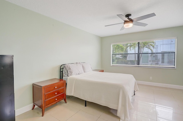 11500 NW 42nd St Unit 1-4, Coral Springs, FL 33065 - bedroom with baseboards, a ceiling fan, and light tile patterned floors