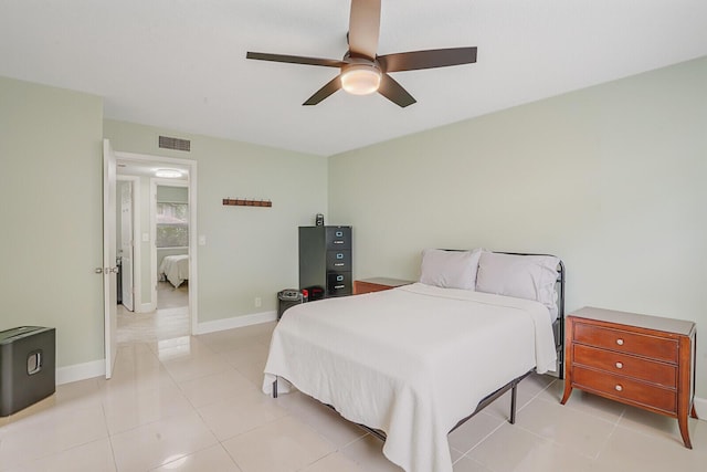 11500 NW 42nd St Unit 1-4, Coral Springs, FL 33065 - bedroom with light tile patterned floors, a ceiling fan, and baseboards