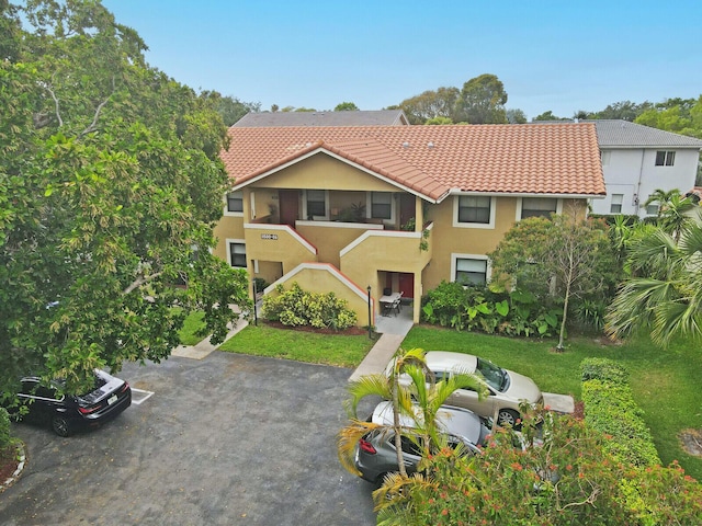 11500 NW 42nd St Unit 1-4, Coral Springs, FL 33065 - view of front of house featuring a tiled roof and stucco siding