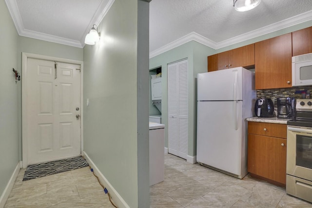 11500 NW 42nd St Unit 1-4, Coral Springs, FL 33065 - kitchen with white appliances, ornamental molding, decorative backsplash, light countertops, and baseboards