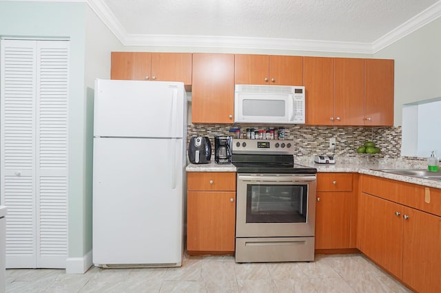 11500 NW 42nd St Unit 1-4, Coral Springs, FL 33065 - kitchen featuring white appliances, ornamental molding, light countertops, decorative backsplash, and a sink