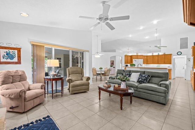 living room featuring ceiling fan, light tile patterned floors, recessed lighting, and a high ceiling
