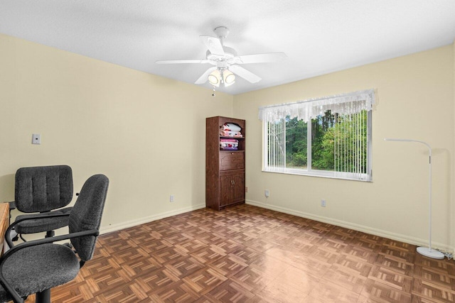 office with baseboards and a ceiling fan