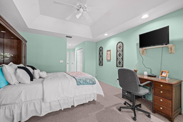 bedroom featuring carpet flooring, recessed lighting, a desk, a closet, and a raised ceiling