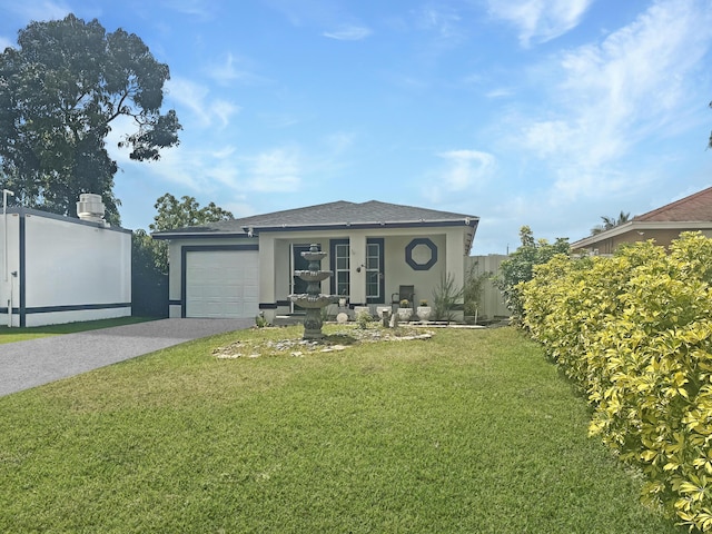3946 A St, Palm Springs, FL 33461 - view of front of home featuring stucco siding, concrete driveway, a garage, a front yard, and roof with shingles