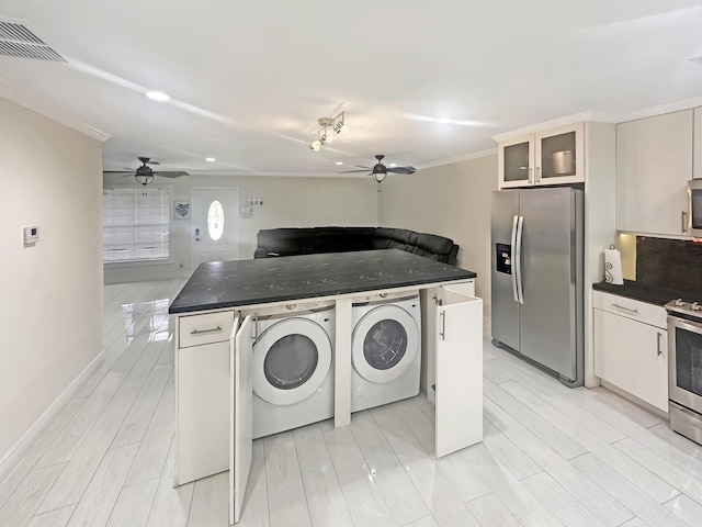 3946 A St, Palm Springs, FL 33461 - clothes washing area with a ceiling fan, washer and dryer, ornamental molding, and baseboards