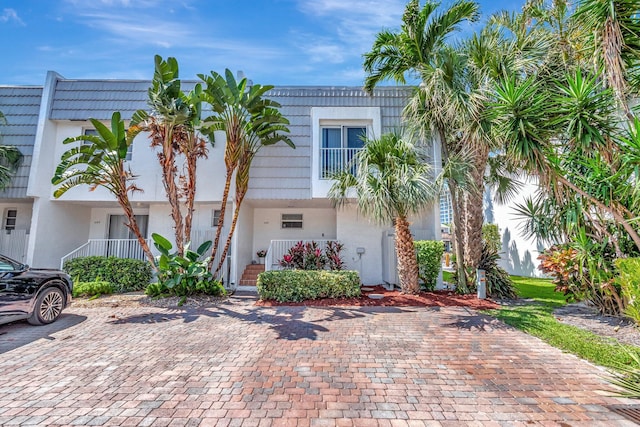 1100 Russell Dr, Highland Beach, FL 33487 - view of property featuring stucco siding