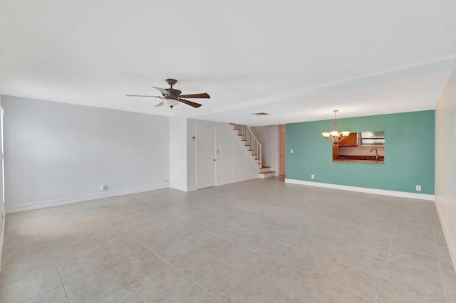1100 Russell Dr, Highland Beach, FL 33487 - unfurnished living room featuring a chandelier, stairway, a ceiling fan, and baseboards
