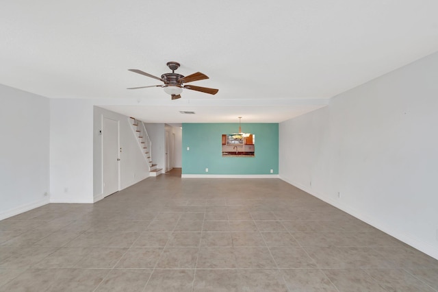 1100 Russell Dr, Highland Beach, FL 33487 - unfurnished living room featuring stairs, a ceiling fan, light tile patterned floors, and baseboards