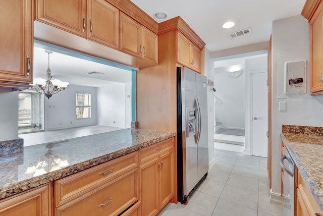 1100 Russell Dr, Highland Beach, FL 33487 - kitchen with stainless steel fridge, light tile patterned flooring, a chandelier, light stone countertops, and decorative light fixtures