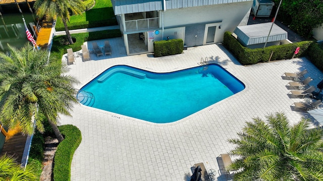 1100 Russell Dr, Highland Beach, FL 33487 - community pool featuring a patio