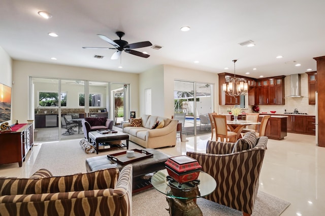 391 Glenbrook Dr, Atlantis, FL 33462 - living room with plenty of natural light, recessed lighting, a ceiling fan, and a chandelier