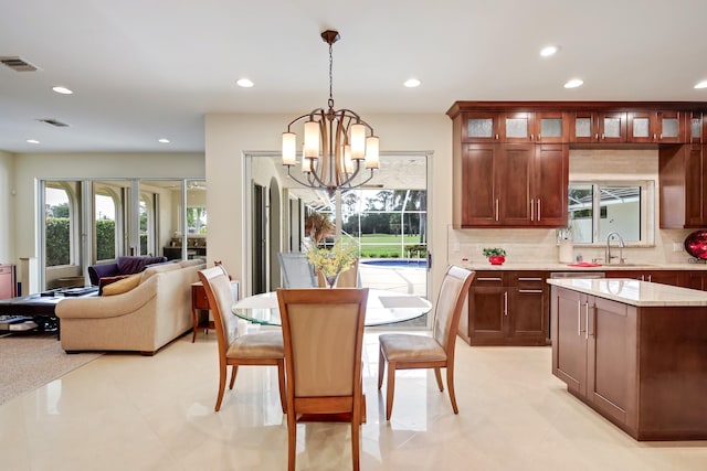 391 Glenbrook Dr, Atlantis, FL 33462 - dining space featuring a chandelier and recessed lighting