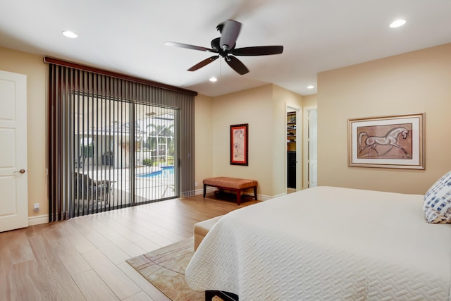 391 Glenbrook Dr, Atlantis, FL 33462 - bedroom with access to outside, wood finished floors, recessed lighting, baseboards, and a walk in closet