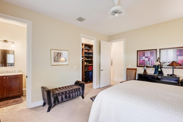 391 Glenbrook Dr, Atlantis, FL 33462 - bedroom with light colored carpet, a spacious closet, a sink, a closet, and baseboards