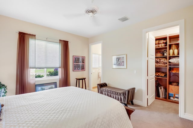 391 Glenbrook Dr, Atlantis, FL 33462 - bedroom with carpet, a walk in closet, baseboards, a closet, and a ceiling fan