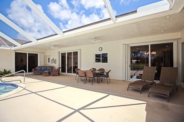 391 Glenbrook Dr, Atlantis, FL 33462 - back of property featuring a ceiling fan, an outdoor hangout area, stucco siding, a patio area, and an outdoor pool