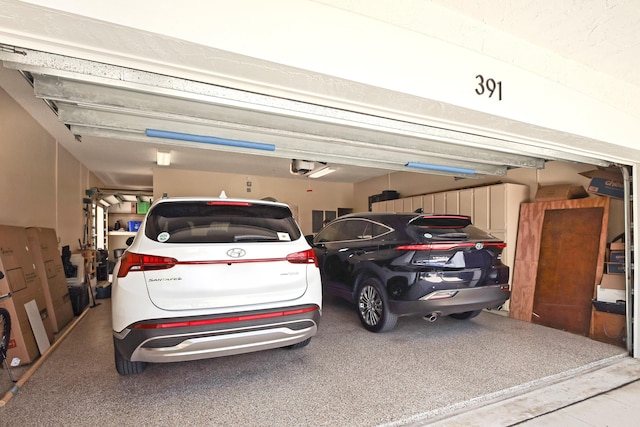 391 Glenbrook Dr, Atlantis, FL 33462 - garage with a garage door opener
