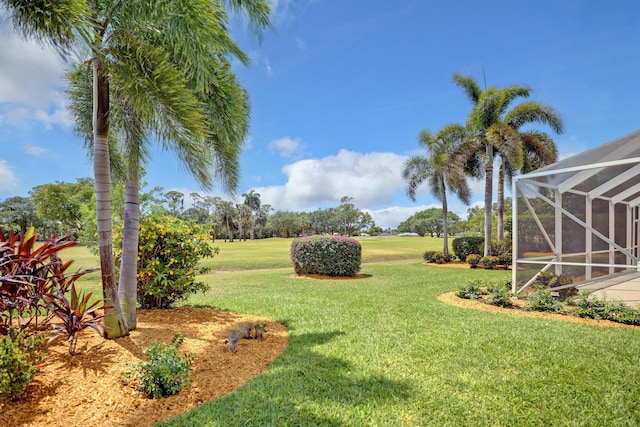 391 Glenbrook Dr, Atlantis, FL 33462 - view of green lawn featuring glass enclosure