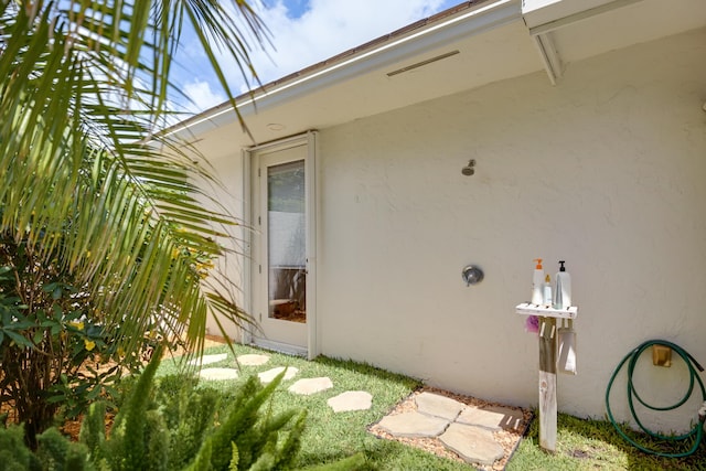 391 Glenbrook Dr, Atlantis, FL 33462 - view of property exterior featuring stucco siding