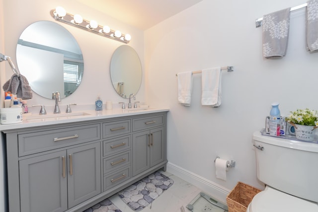 2860 S Ocean Blvd Unit 202, Palm Beach, FL 33480 - bathroom with toilet, marble look tiles, baseboards, and double vanity