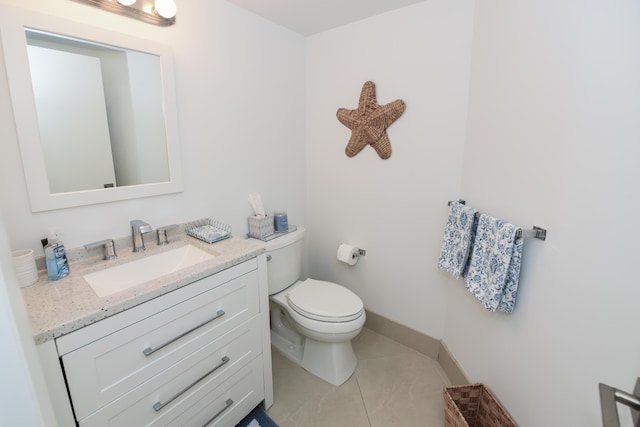 2860 S Ocean Blvd Unit 202, Palm Beach, FL 33480 - bathroom featuring tile patterned flooring, toilet, vanity, and baseboards