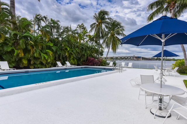 2860 S Ocean Blvd Unit 202, Palm Beach, FL 33480 - community pool featuring a patio and fence